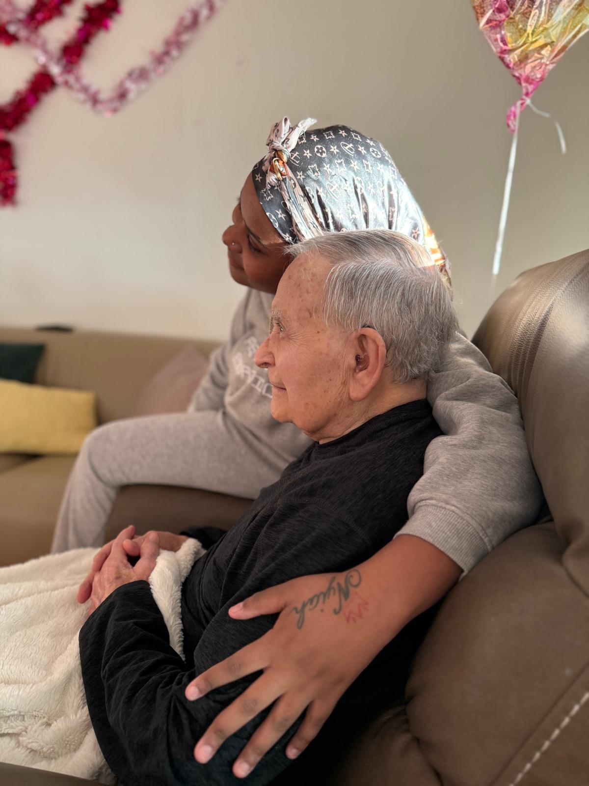 Caregiver providing attentive personal care to a resident